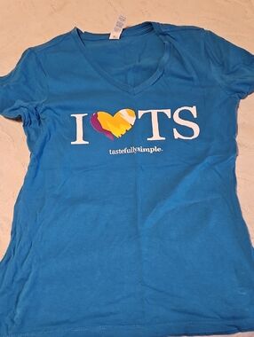 Set Of Shirts With Tastefully Simple Logo On Them